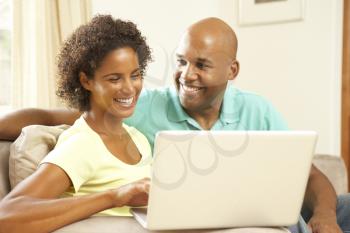 Royalty Free Photo of a Couple With a Laptop