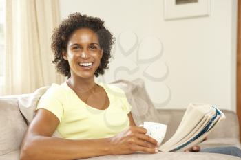 Royalty Free Photo of a Woman Reading a Book