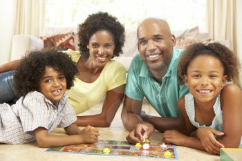 Royalty Free Photo of a Family Playing a Game