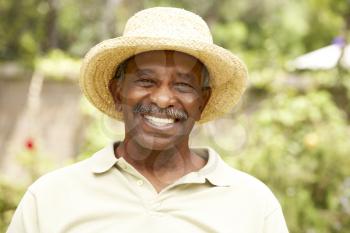 Royalty Free Photo of a Man Outdoors in a Hat