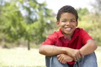 Portrait Of Young Boy In Park