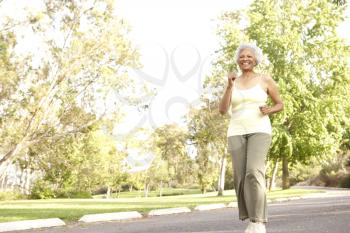Senior Woman Jogging In Park