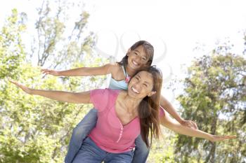 Mother And Daughter Enjoying Day In Park