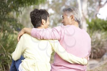 Back View Of Senior Couple In Park