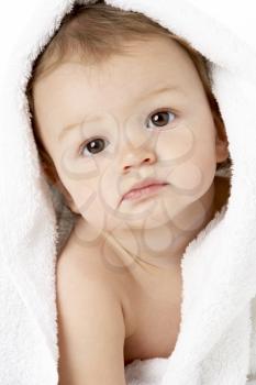 Studio Portrait Of Baby Boy Wrapped In Towel