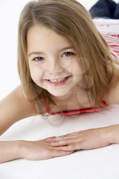 Young Girl Lying On Stomach In Studio