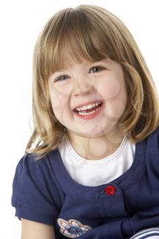 Studio Portrait Of Laughing Young Girl