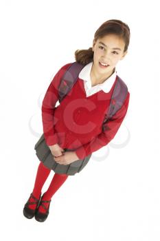 Studio Portrait Of Female Student In Uniform With Backpack