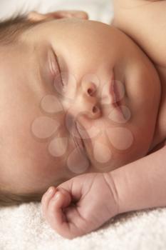 Close Up Of Baby Sleeping On Towel