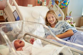 Teenage Girl With Newborn Baby Son In Hospital
