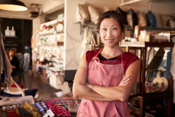 Portrait Of Female Owner Standing In Gift Store