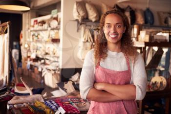 Portrait Of Female Owner Standing In Gift Store