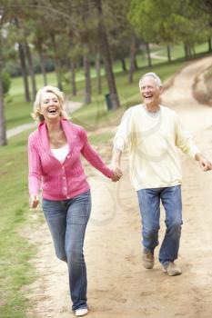 Senior Couple enjoying walk in park