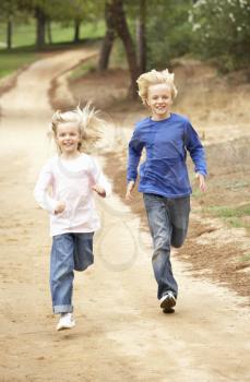 Two Children running in park