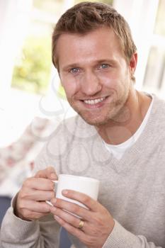 Man drinking from cup