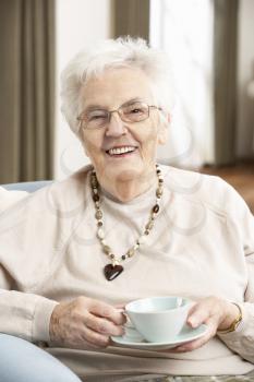 Senior Woman Enjoying Cup Of Tea At Home