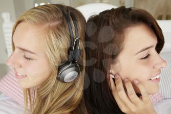 Teenage girls listening to music