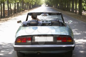 Man in sports car