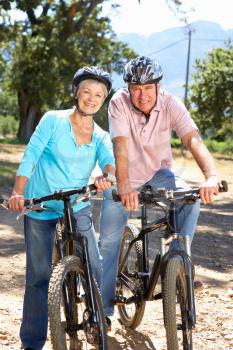 Senior couple on country bike ride