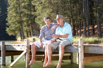 Father and adult son fishing together