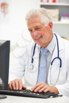 Senior doctor at desk