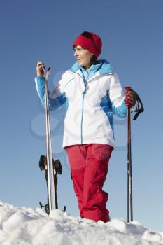 Middle Aged Woman On Ski Holiday In Mountains