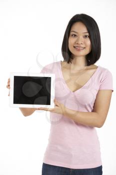 Studio Shot Of Chinese Woman Holding Digital Tablet