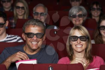 Couple Watching 3D Film In Cinema