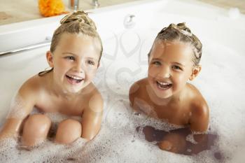 Two Girls Playing In Bath Together