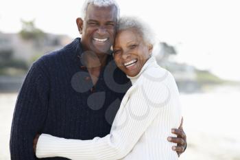 Romantic Senior Couple Hugging On Beach