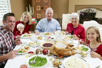 Multi Generation Family Celebrating With Christmas Meal