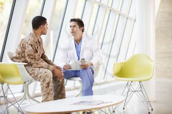 Doctor Counselling Soldier Suffering From Stress