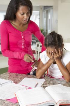 Angry Mother Telling Off Daughter About Homework