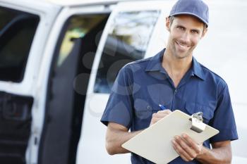 Portrait Of Delivery Driver With Clipboard