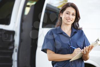 Portrait Of Female Delivery Driver With Clipboard