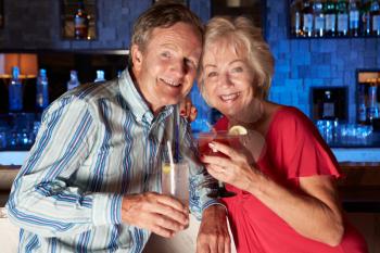 Senior Couple Enjoying Cocktail In Bar