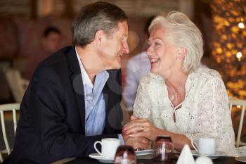 Romantic Senior Couple In Restaurant