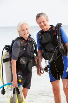 Senior Couple With Scuba Diving Equipment Enjoying Holiday