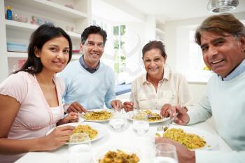 Indian Family Eating Meal At Home