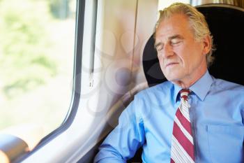Businessman Resting On Train