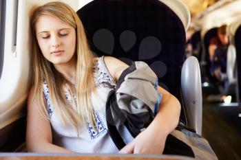 Teenage Girl Resting On Train Journey