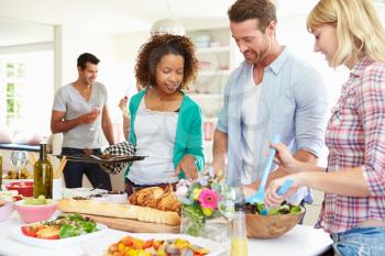 Group Of Friends Having Dinner Party At Home