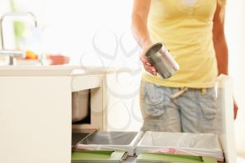 Close Up Of Woman Recycling Kitchen Waste In Bin