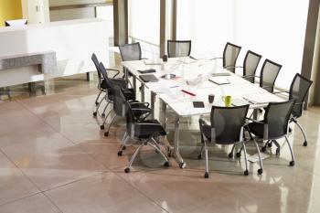 Chairs Arranged Around Empty Boardroom Table