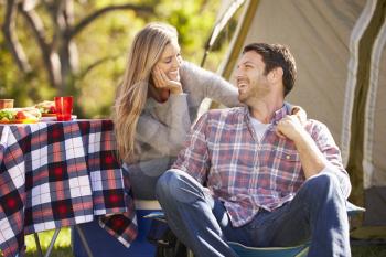 Couple Enjoying Camping Holiday In Countryside