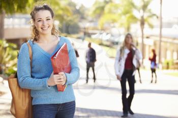 Portrait Of Female University Student Outdoors On Campus