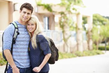 Portrait Of Student Couple Outdoors On University Campus