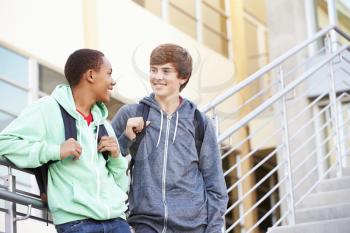 Two Male High School Students Standing Outside Building