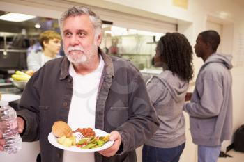 Kitchen Serving Food In Homeless Shelter