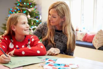 Mother And Daughter Writing Letter To Santa Together